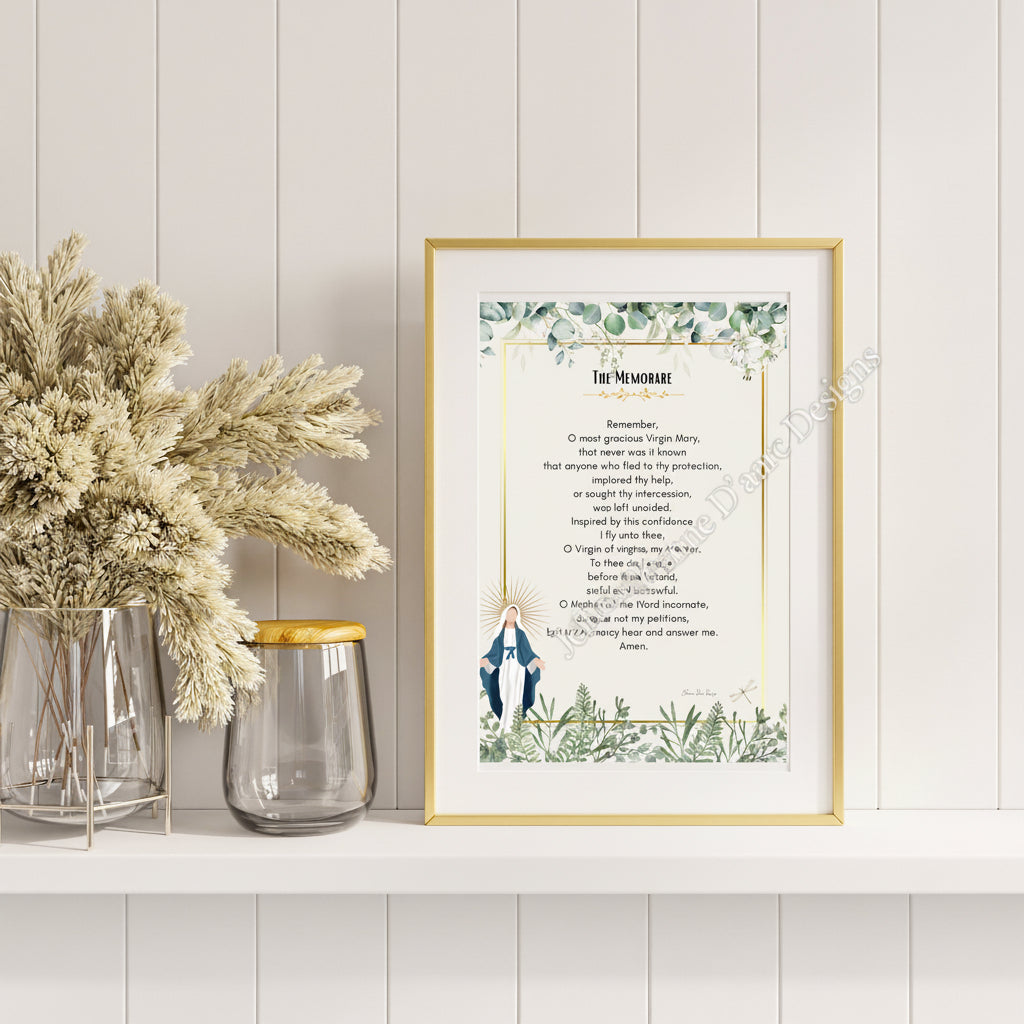 Framed print of 'The Memorare' prayer with decorative elements on a wooden wall.