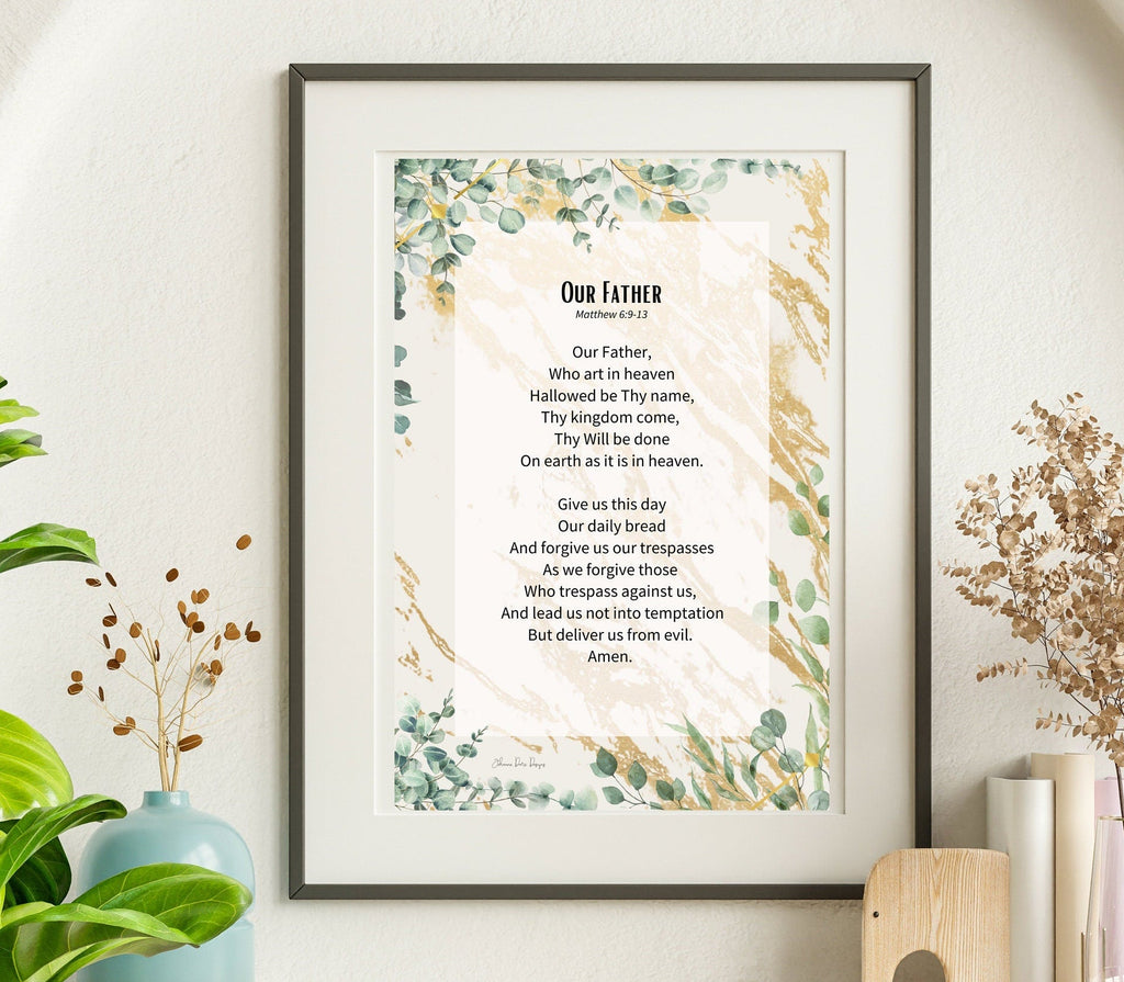 Framed print of 'Our Father' prayer on a wall with decorative elements.